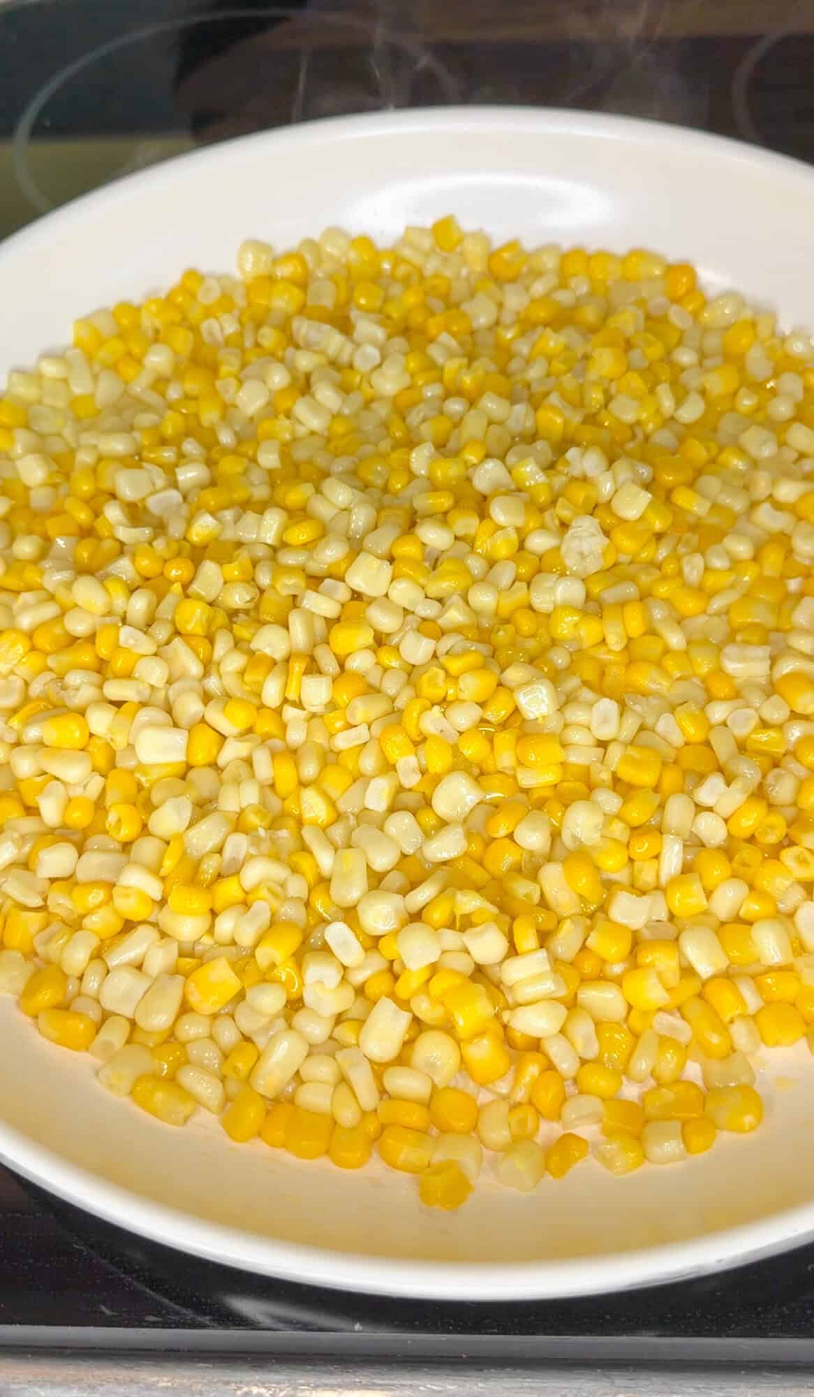 corn saut&eacute;ing in butter
