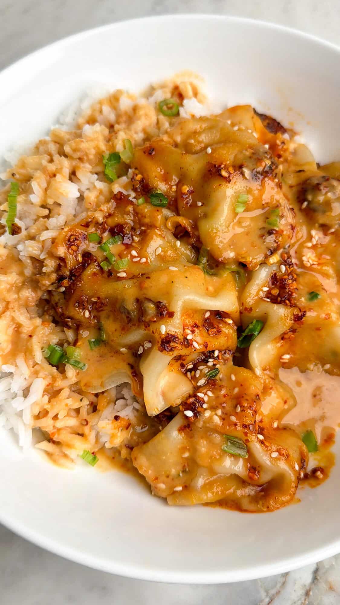 blanket dumplings in a pan with Thai peanut sauce