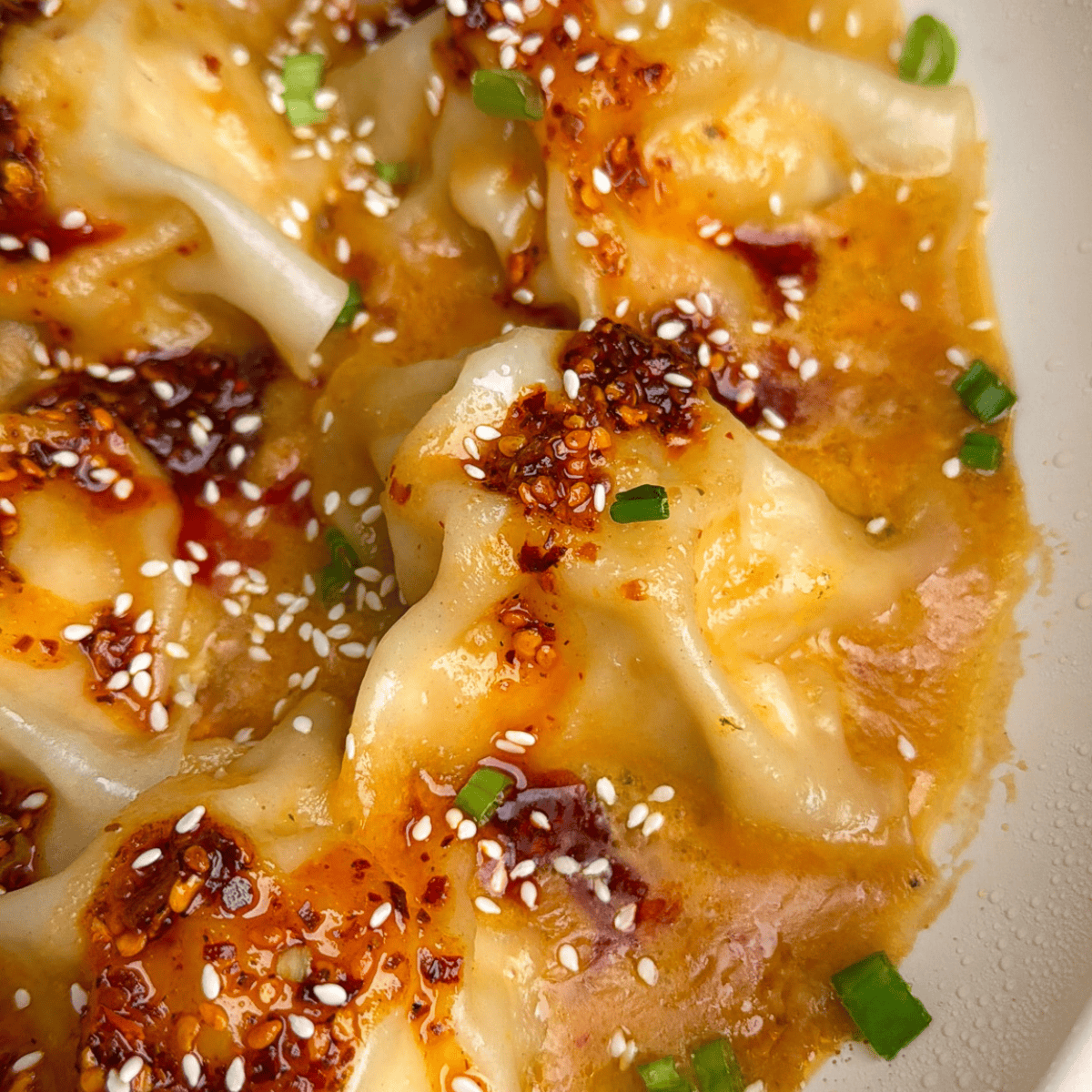 blanket dumplings in a pan with Thai peanut sauce