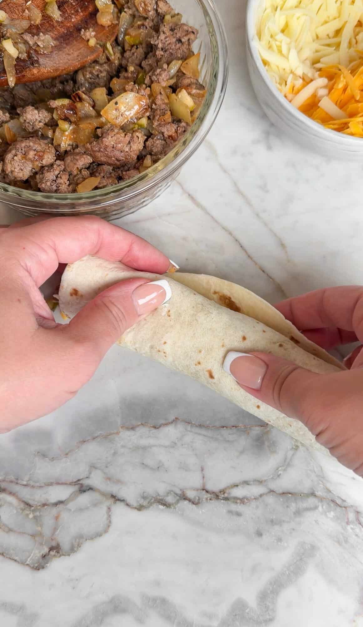 rolling cheeseburger taquitos