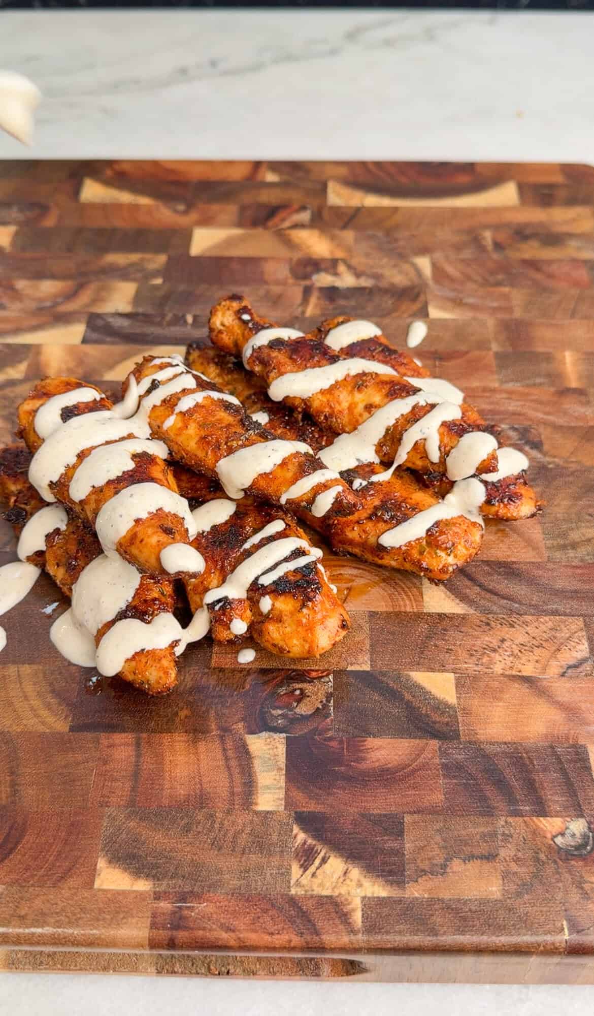 dressing chicken tenders before chopping