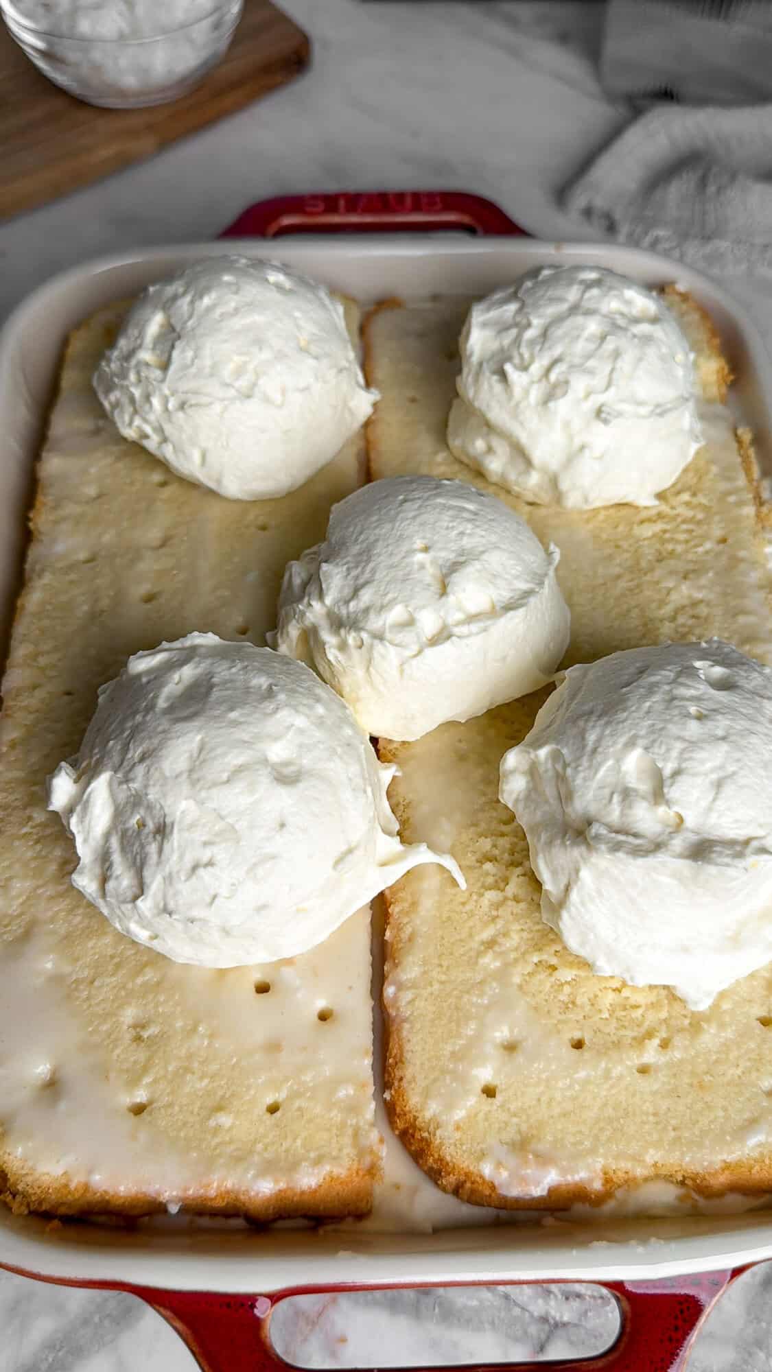 assembling the second layer of this easy coconut cake