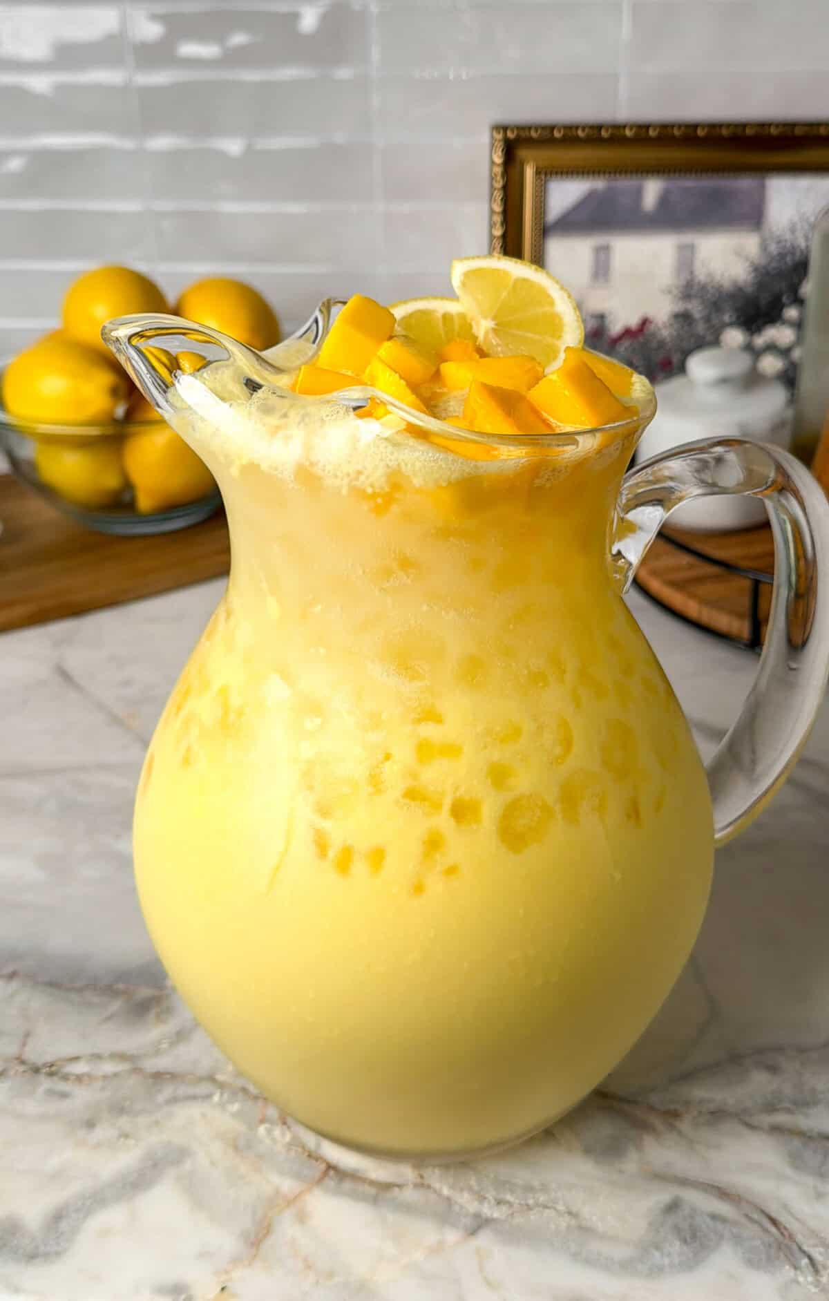 mango lemonade in a pitcher