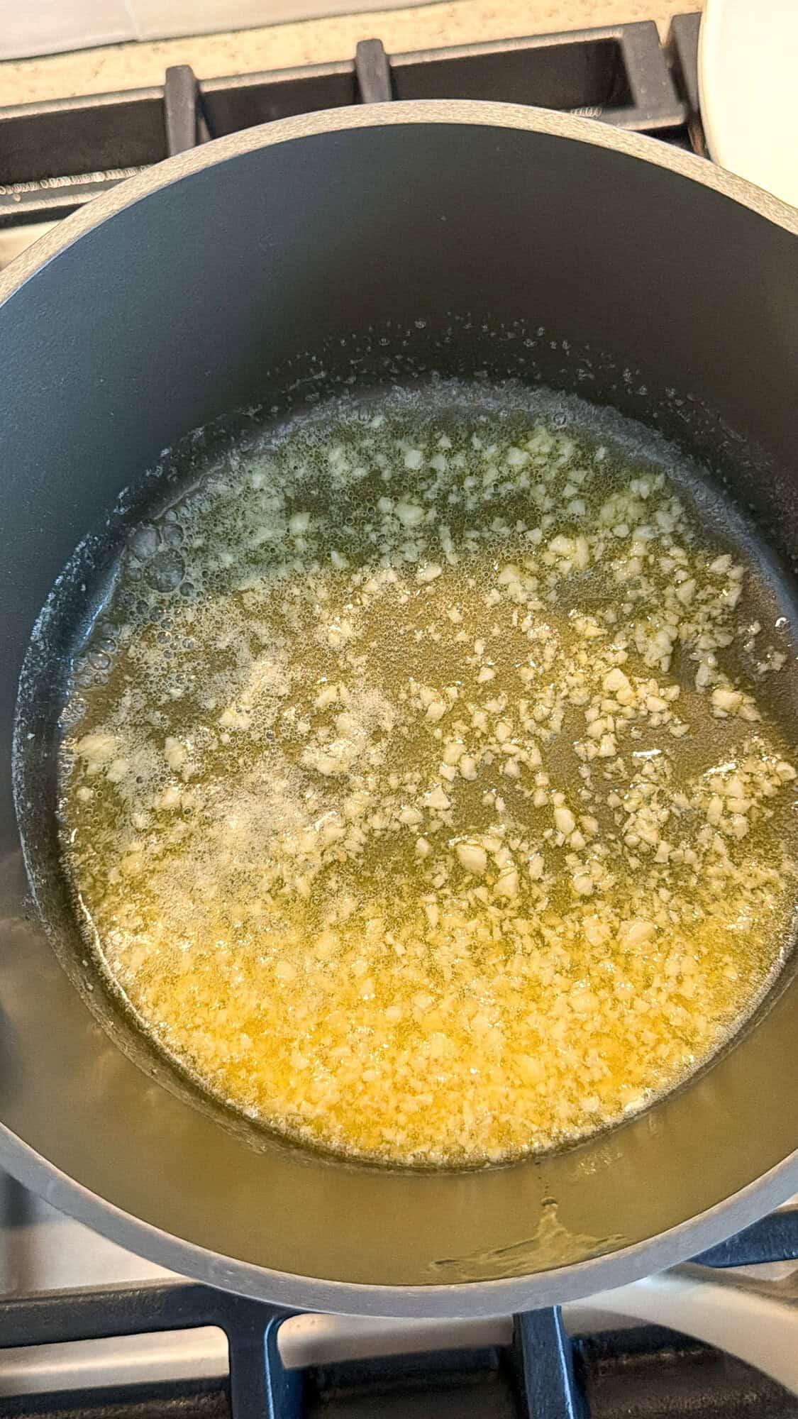 melting butter and garlic for chicken caesar wrap