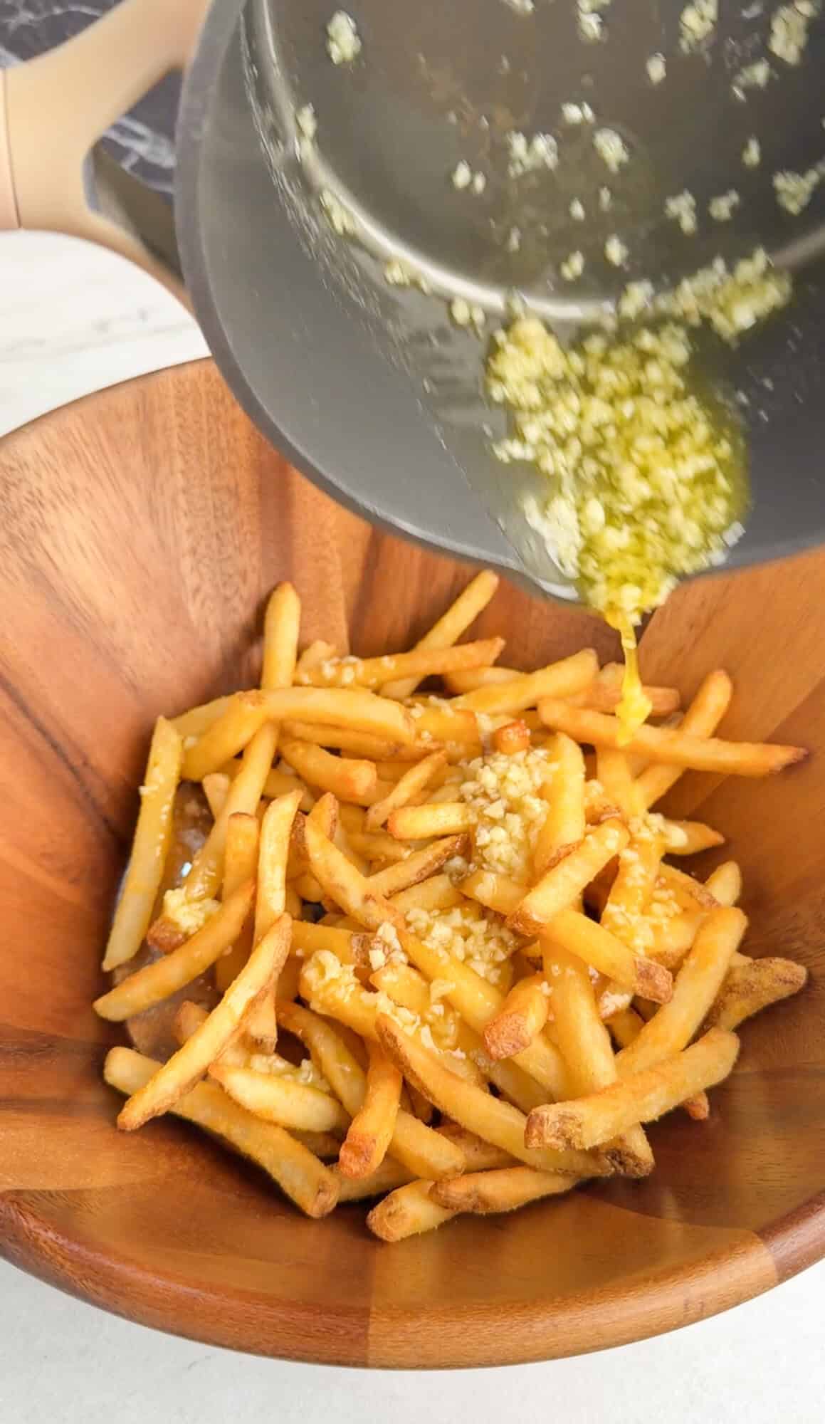 pouring over garlic butter