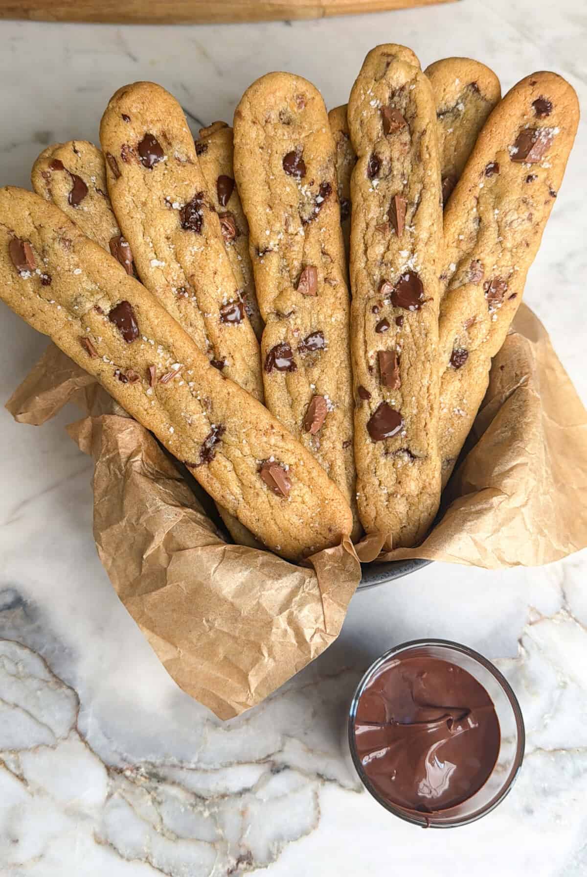 chocolate chip cookie fries on a platter with chocolate sauce for dipping
