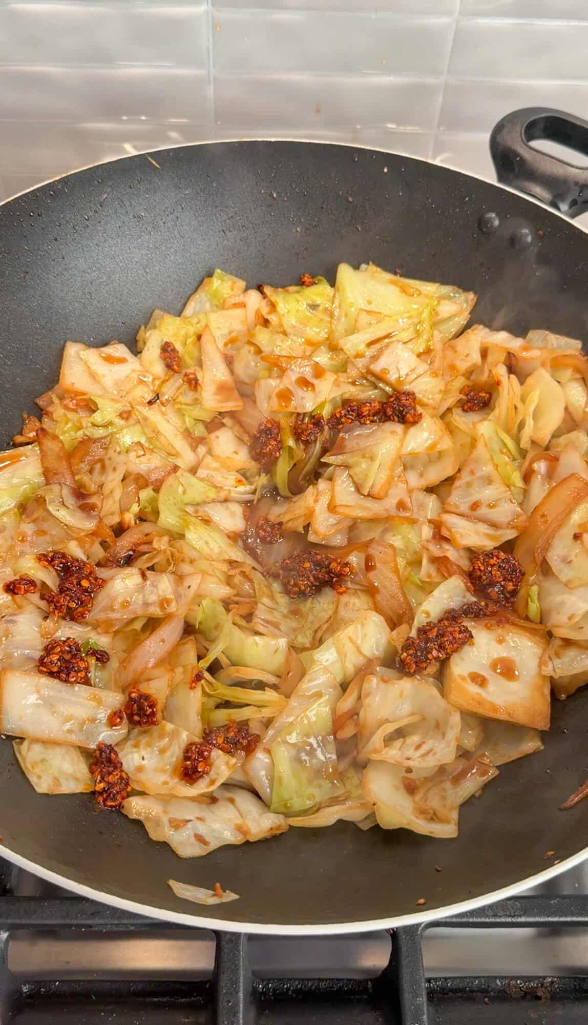 adding sauce to dirty cabbage
