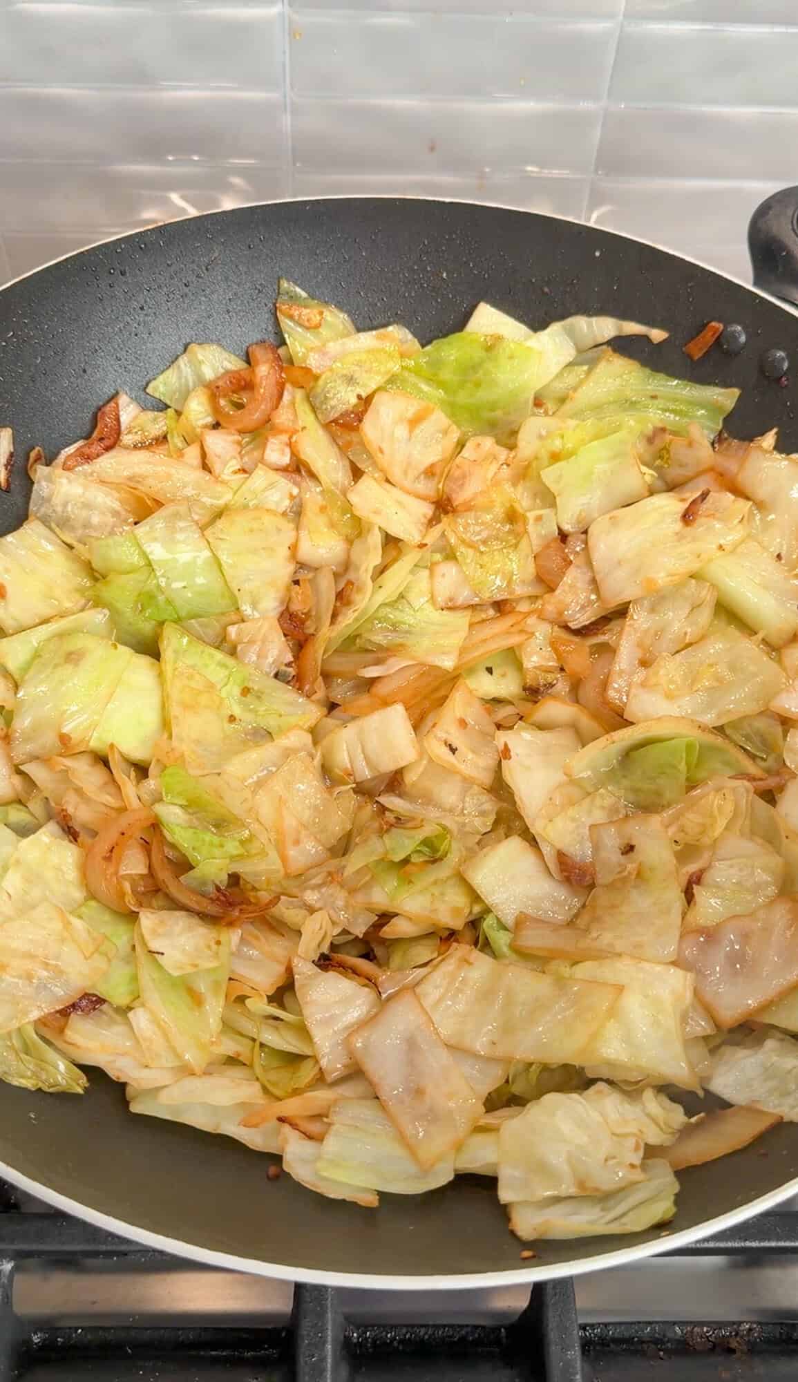 sautéing cabbage in a wok