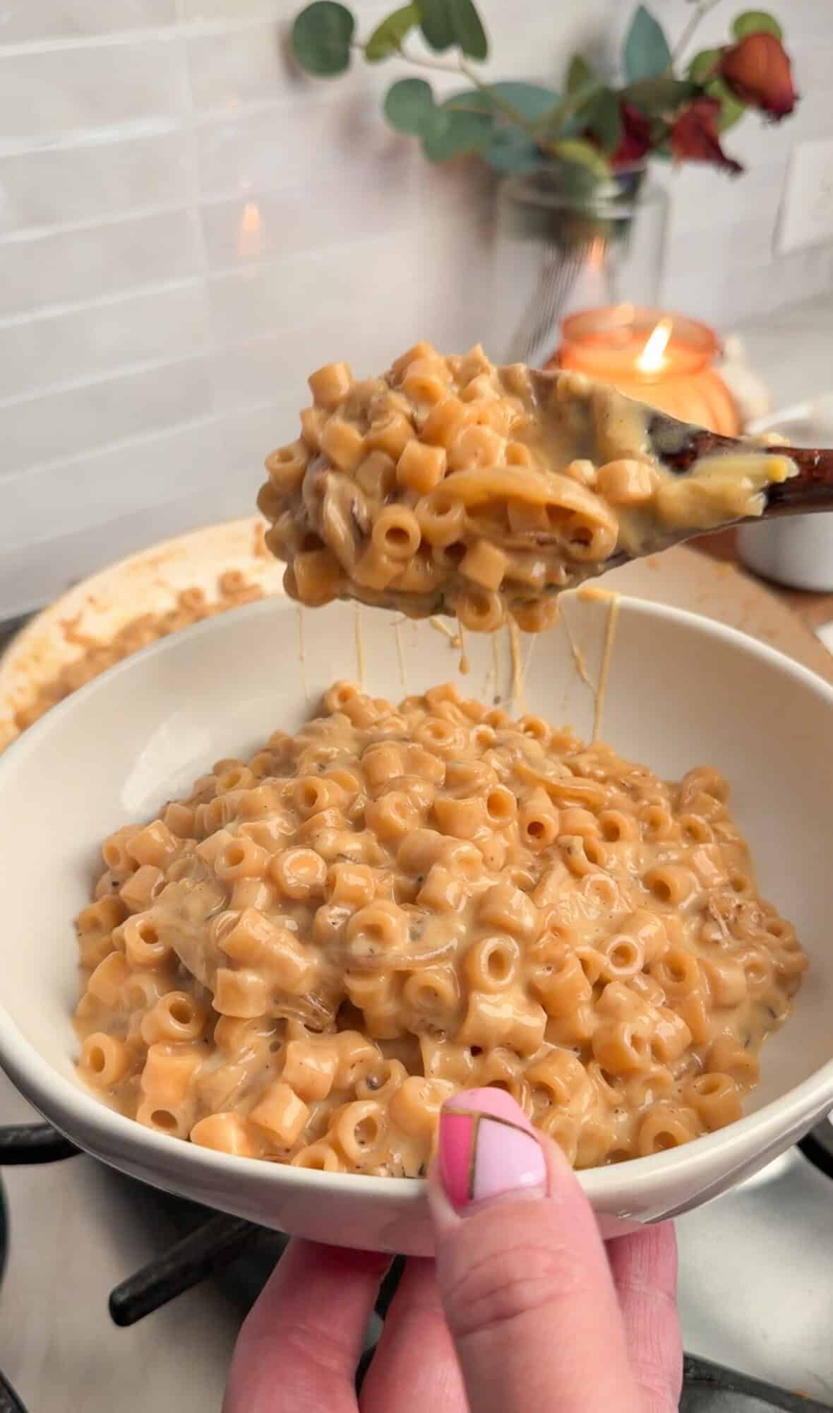 french onion mac and cheese plated in a bowl