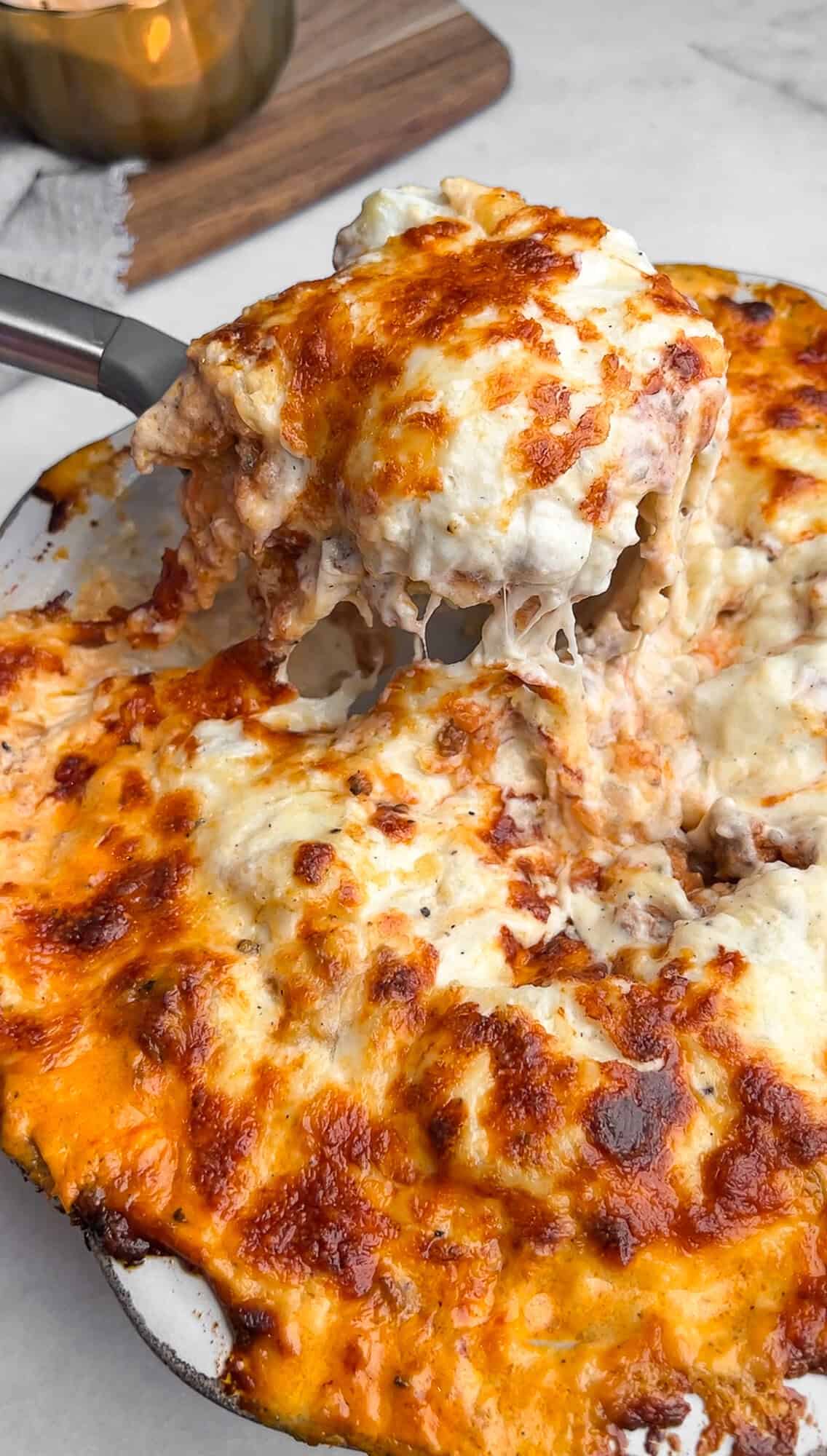 mashed potato lasagna being scooped with a spatula