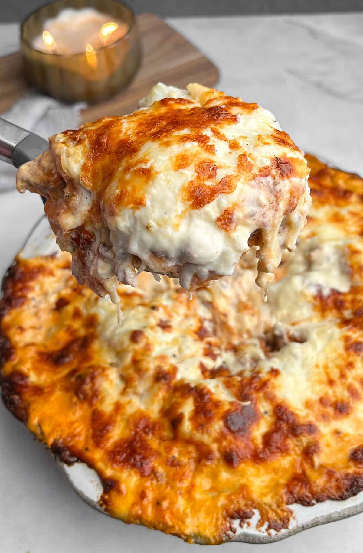 potato lasagna scooped on a spatula