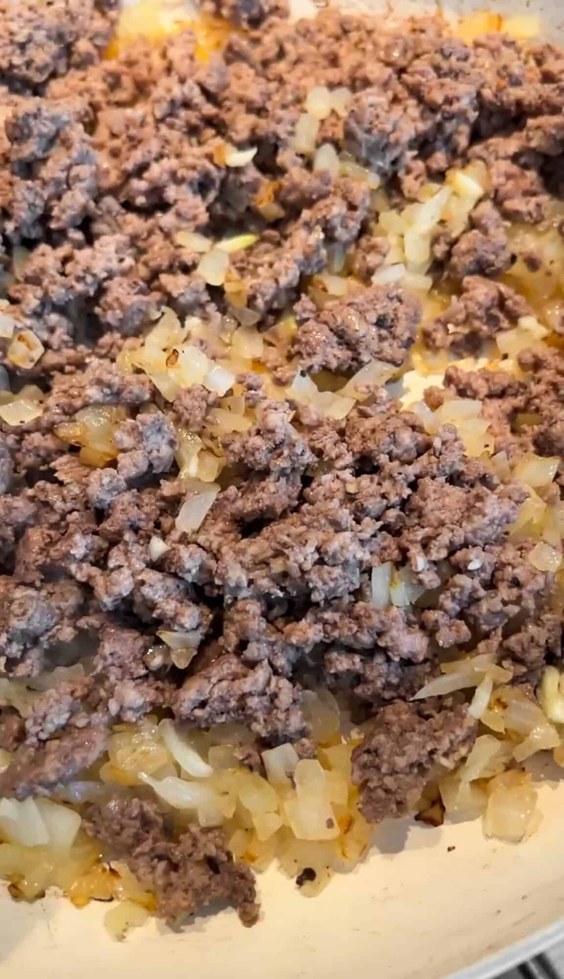 browning the meat with onions
