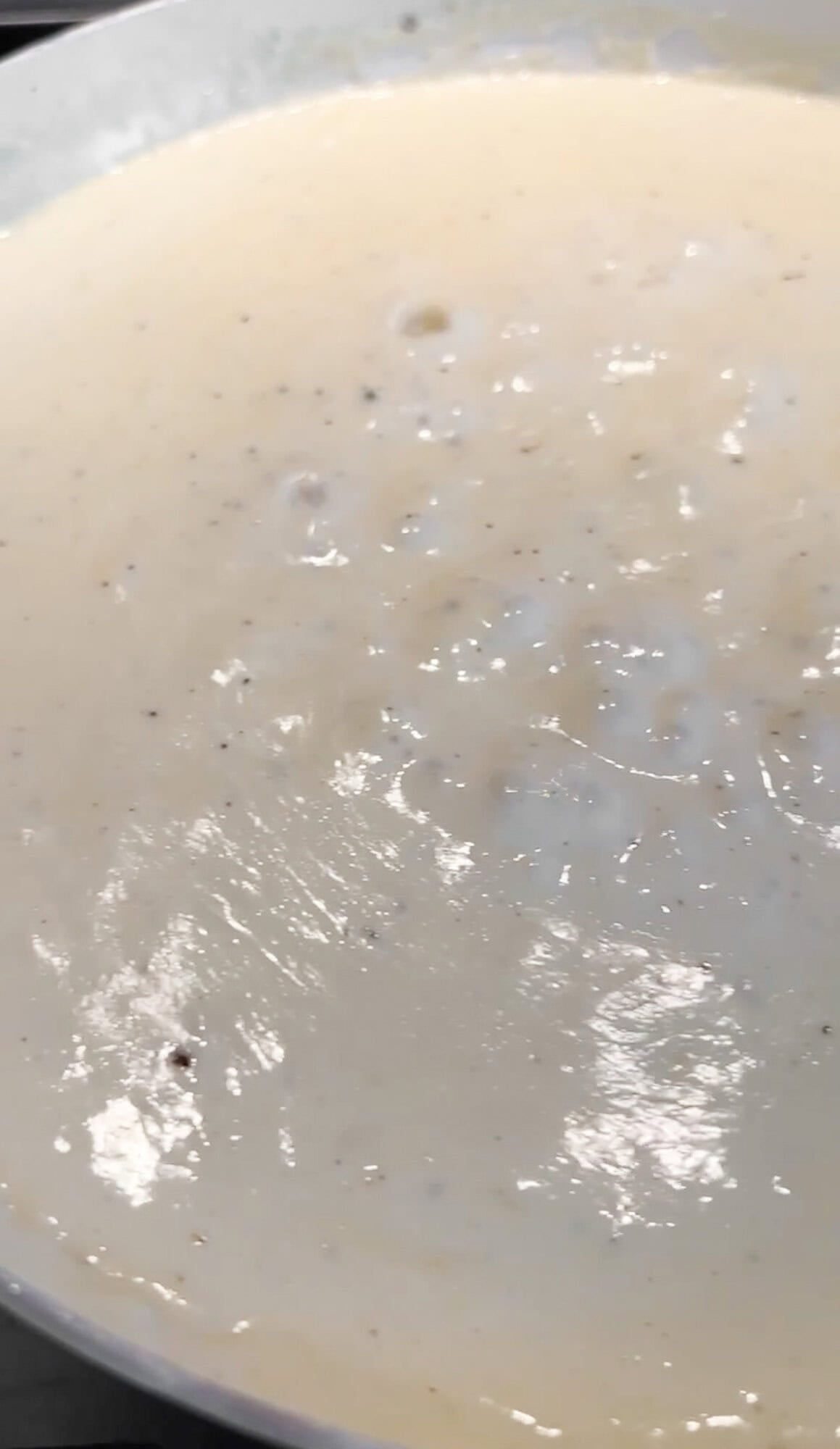 thickened and bubbling alfredo sauce