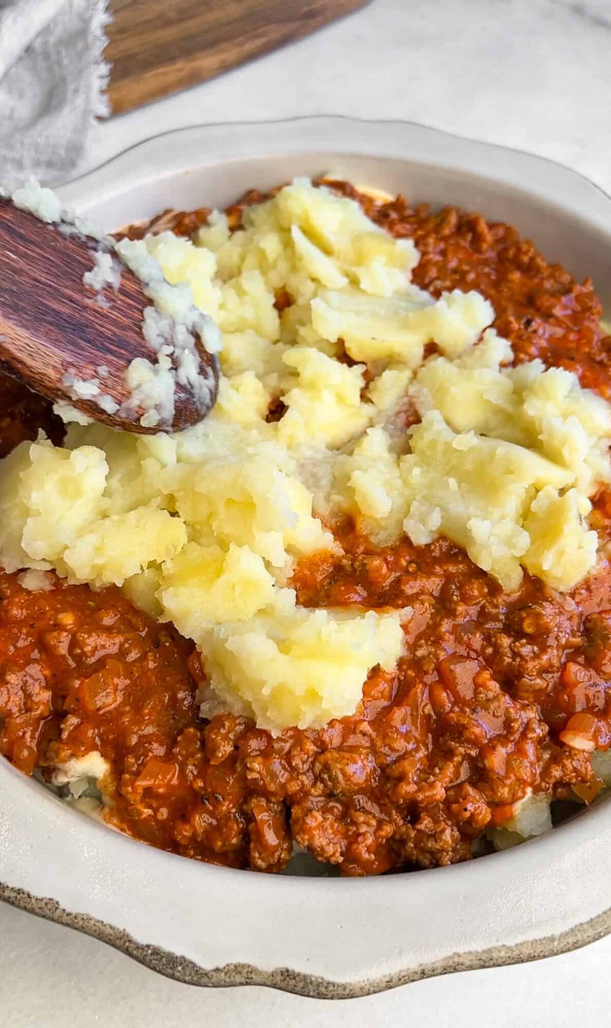 assembling mashed potato lasagna