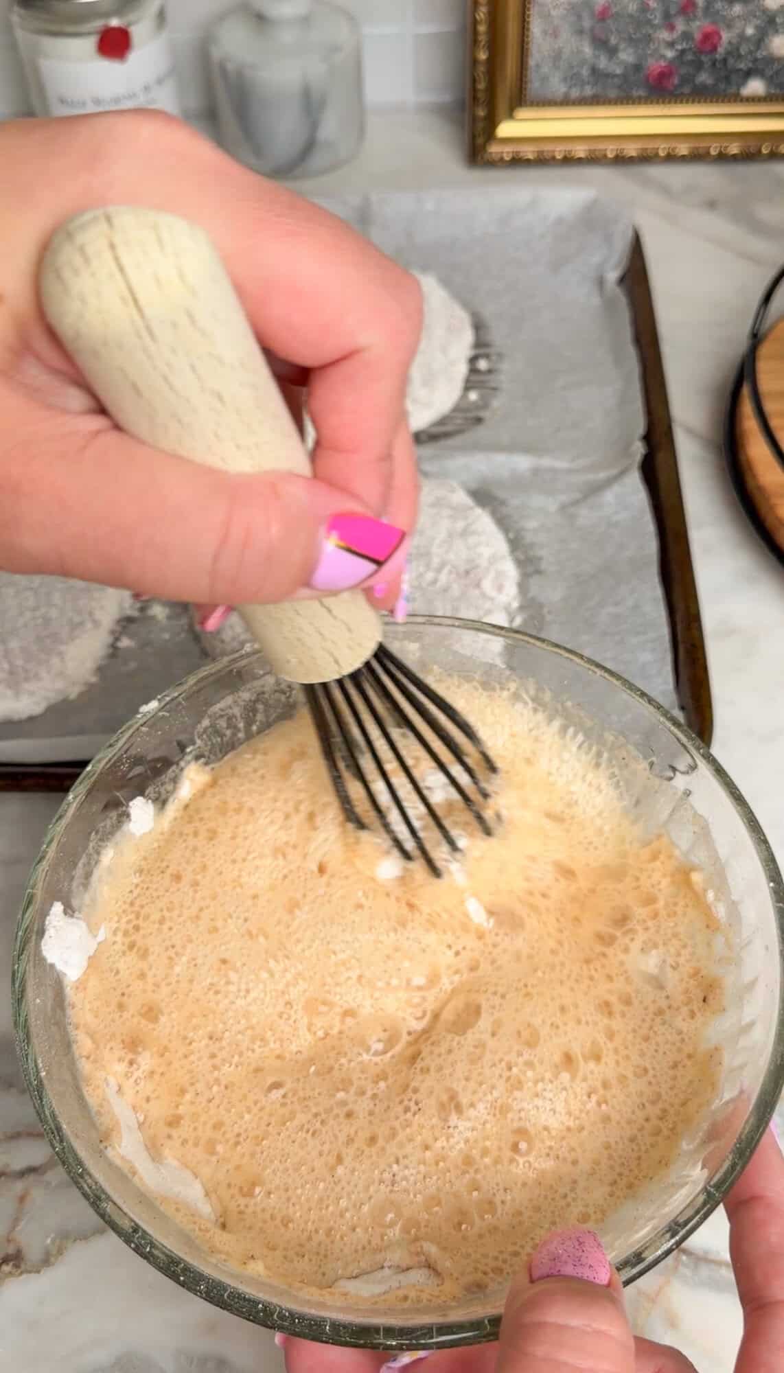 whisking in club soda to wet batter