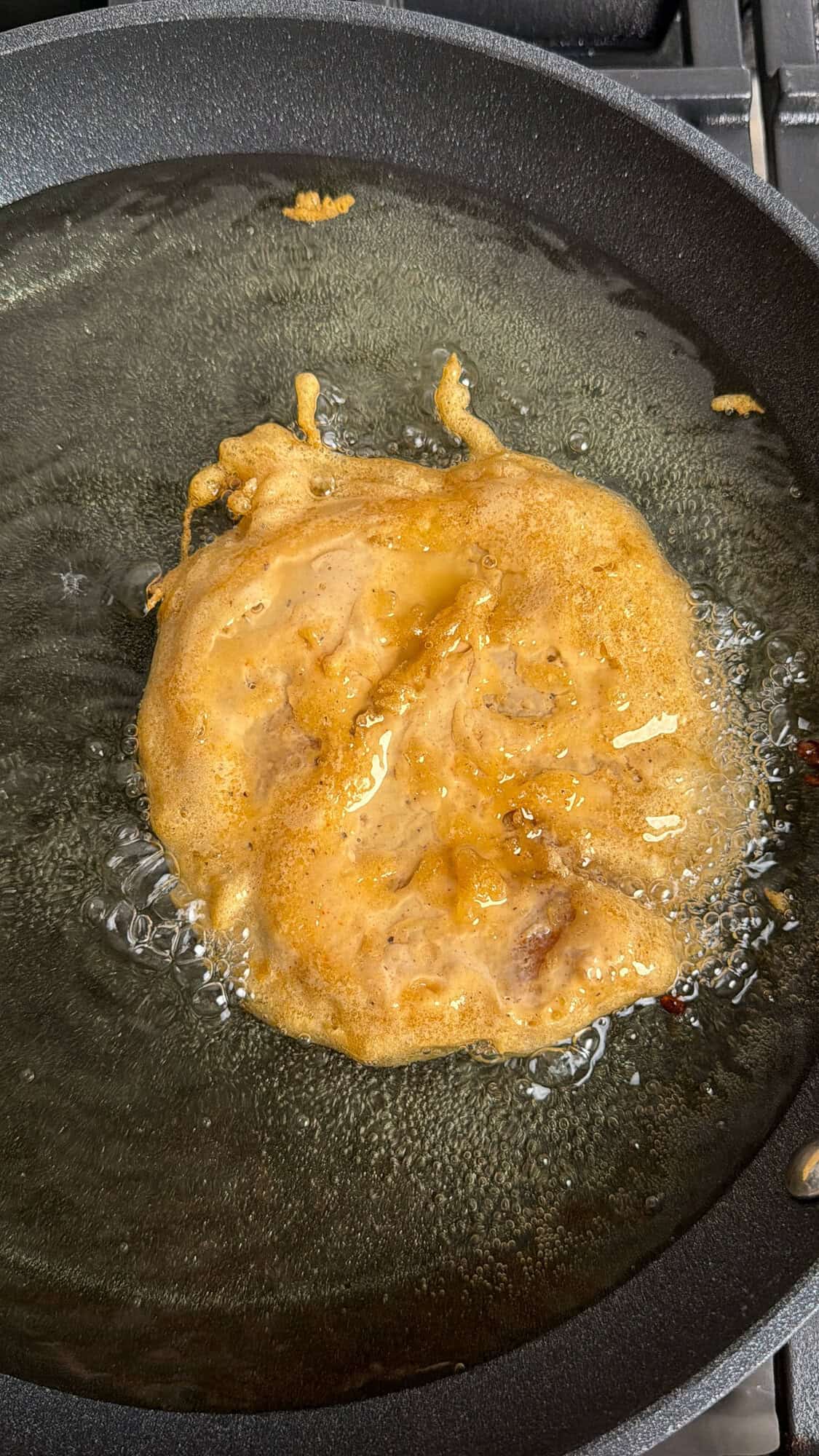 mcchicken patty frying in a pan