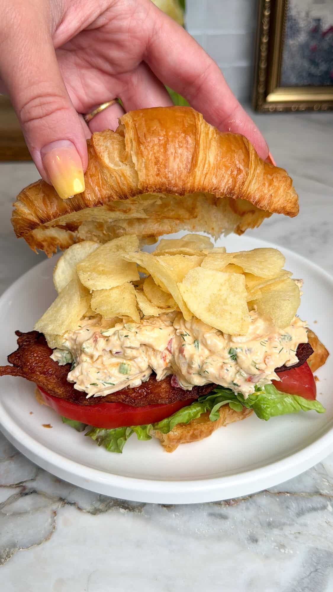 assembling pepperoncini chicken salad sandwich