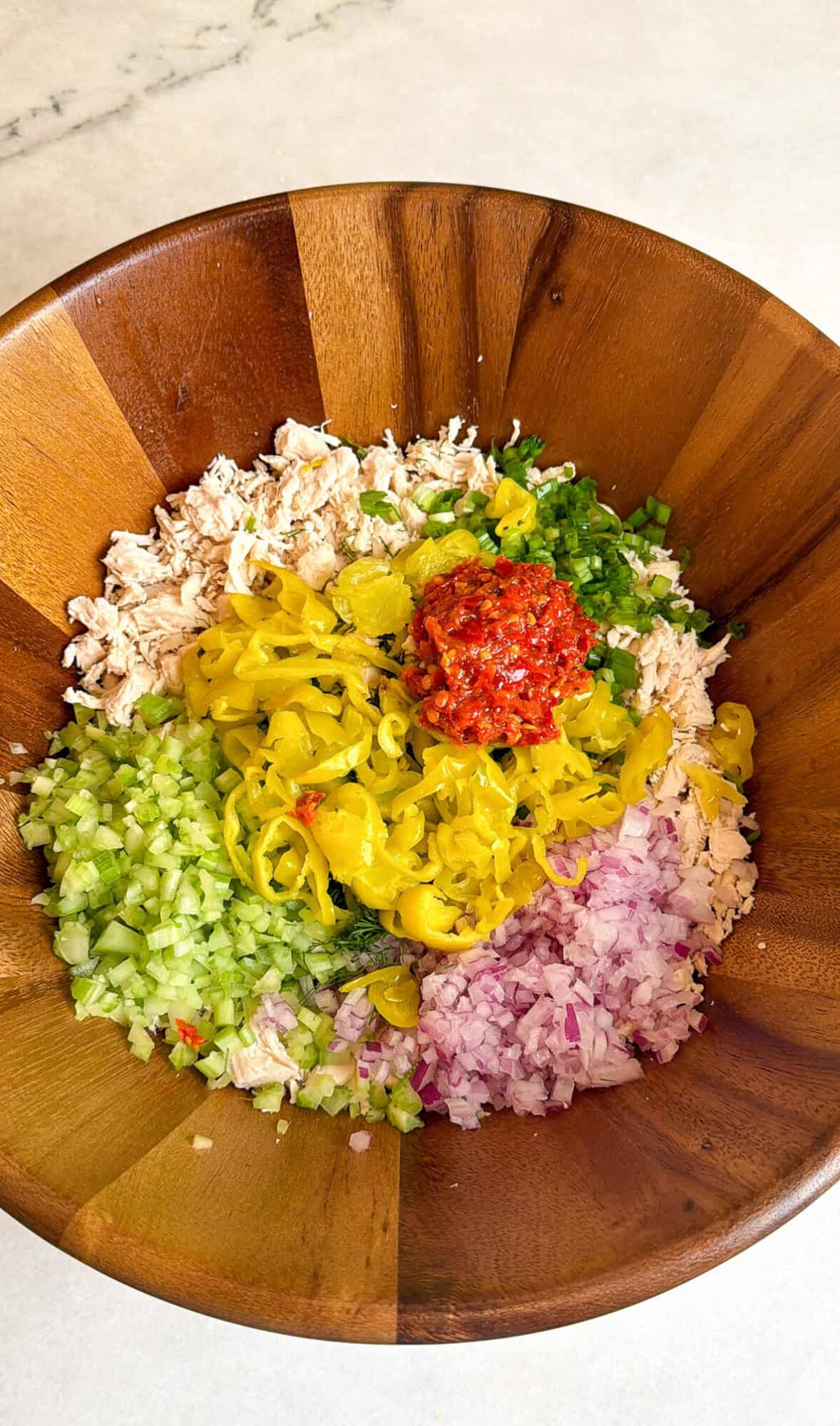 pepperoncini chicken salad ingredients in a bowl