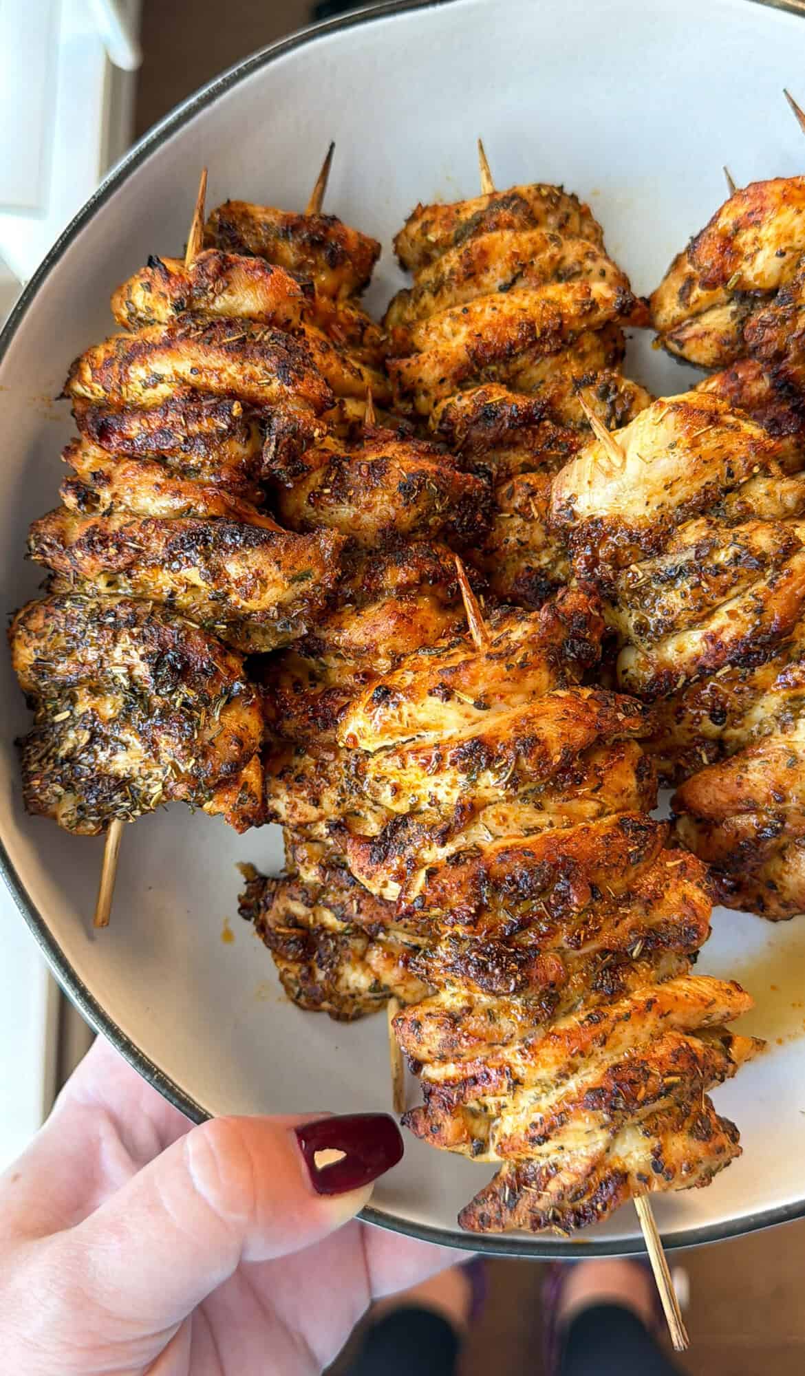 An easy Greek chicken rice bowl with juicy air-fryer chicken skewers, fresh tomato-cucumber salad and creamy garlic-dill yogurt sauce. Perfectly air-fried Greek chicken skewers.