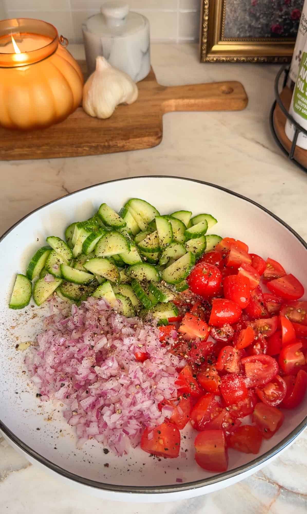 Season and Marinate the Chicken Red onion, tomato, and cucumber on a plate topped with salt, pepper, olive oil, and fresh lemon juice.