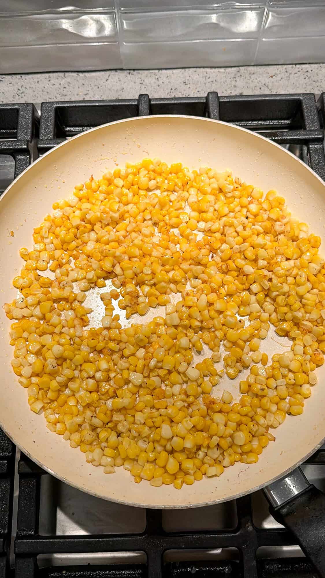 kernels of corn cooking in butter