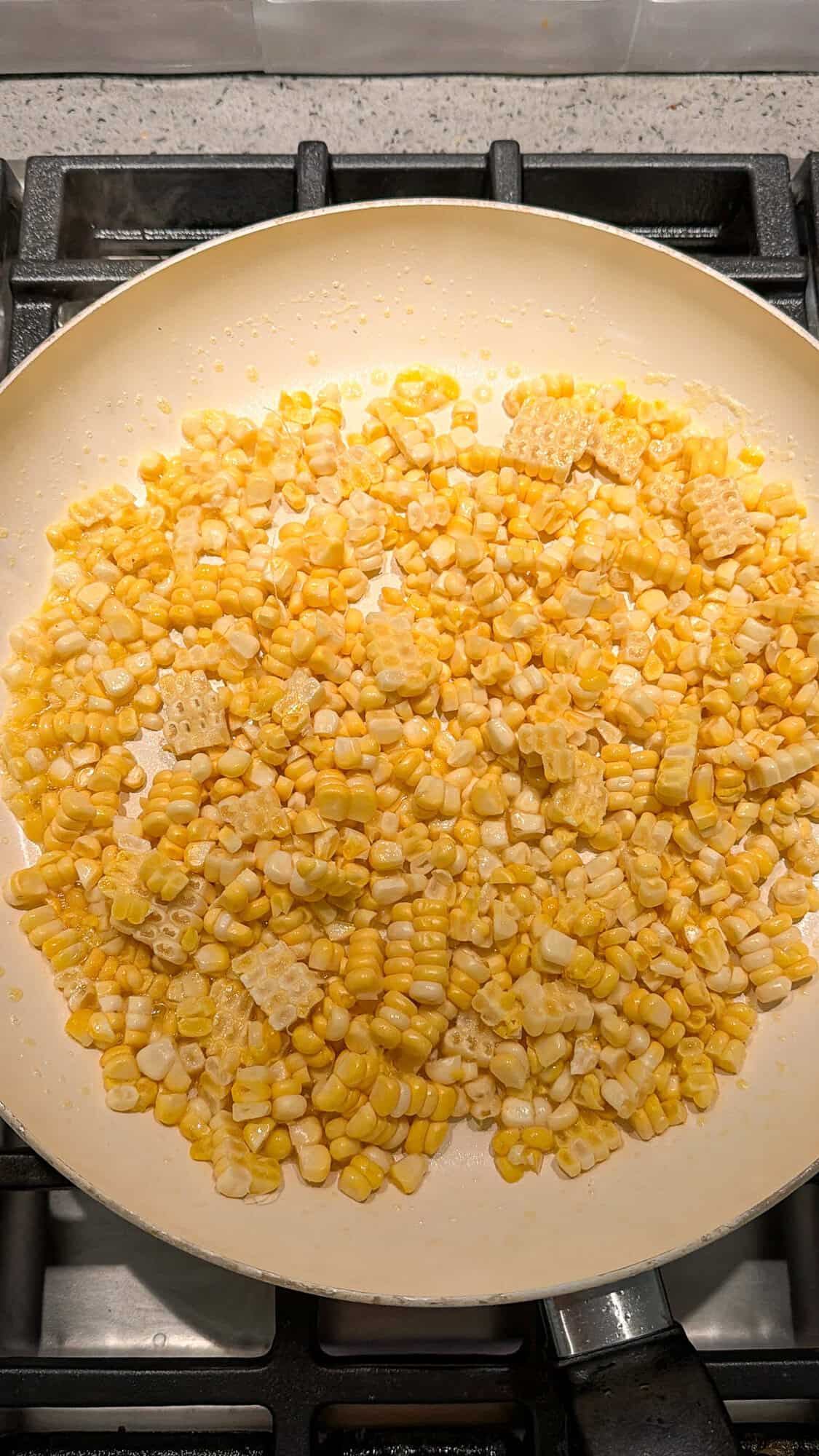 kernels of corn cooking in butter