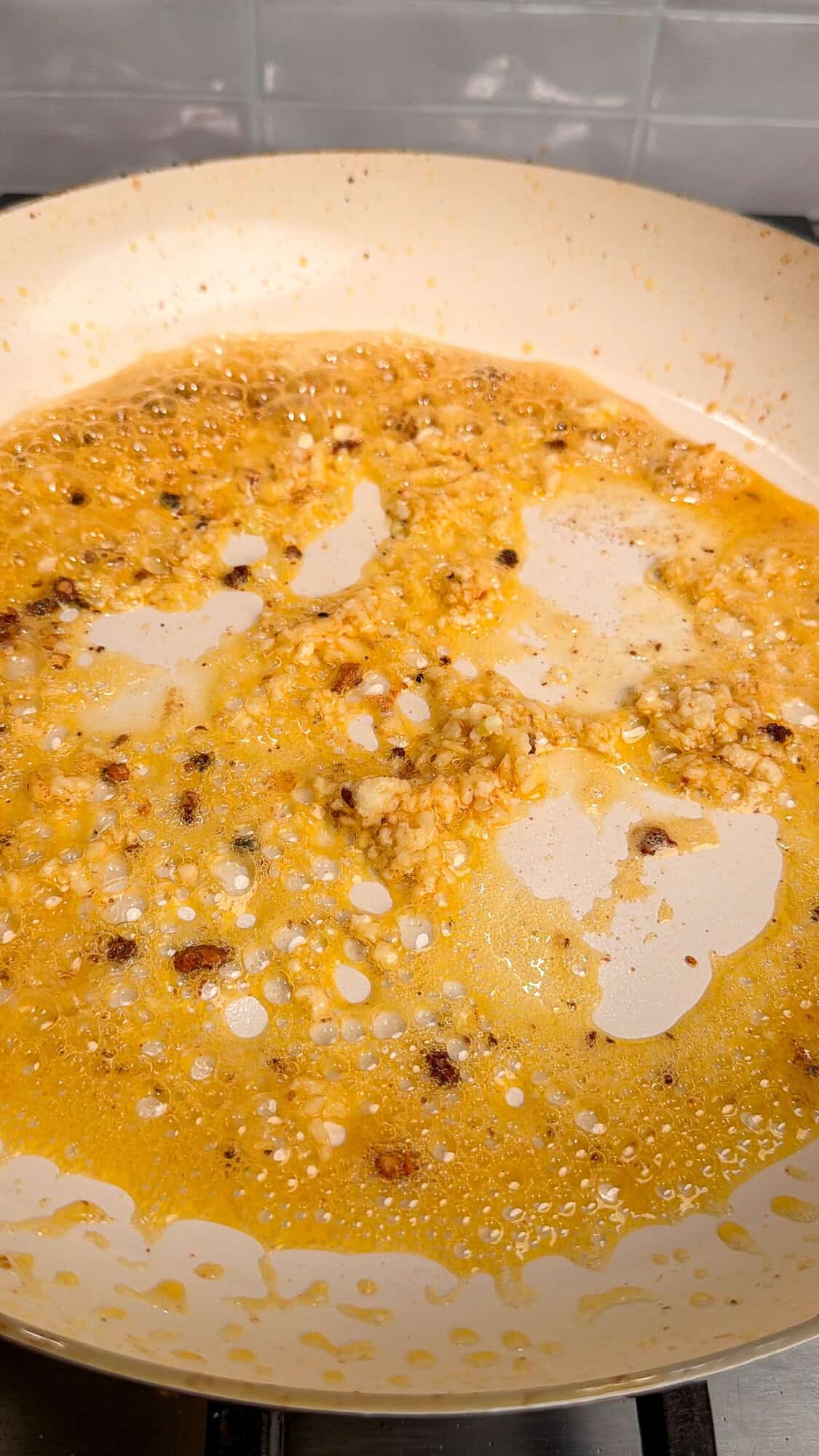 butter and garlic sizzling in a pan