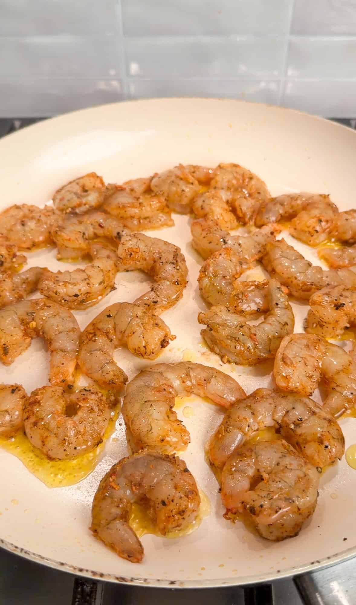 cooking shrimp in a pan for cheesecake factory cajun salmon