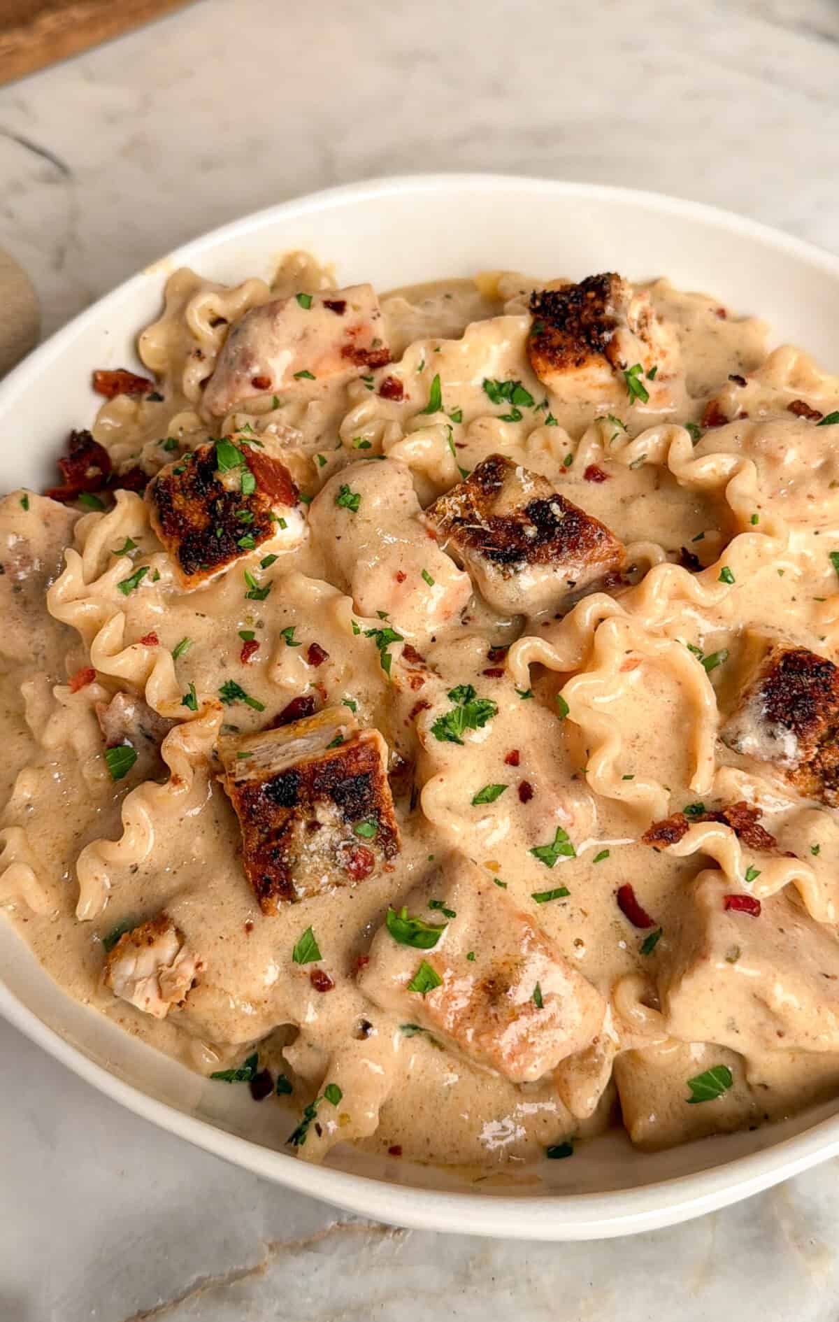 chicken alfredo soup in a bowl