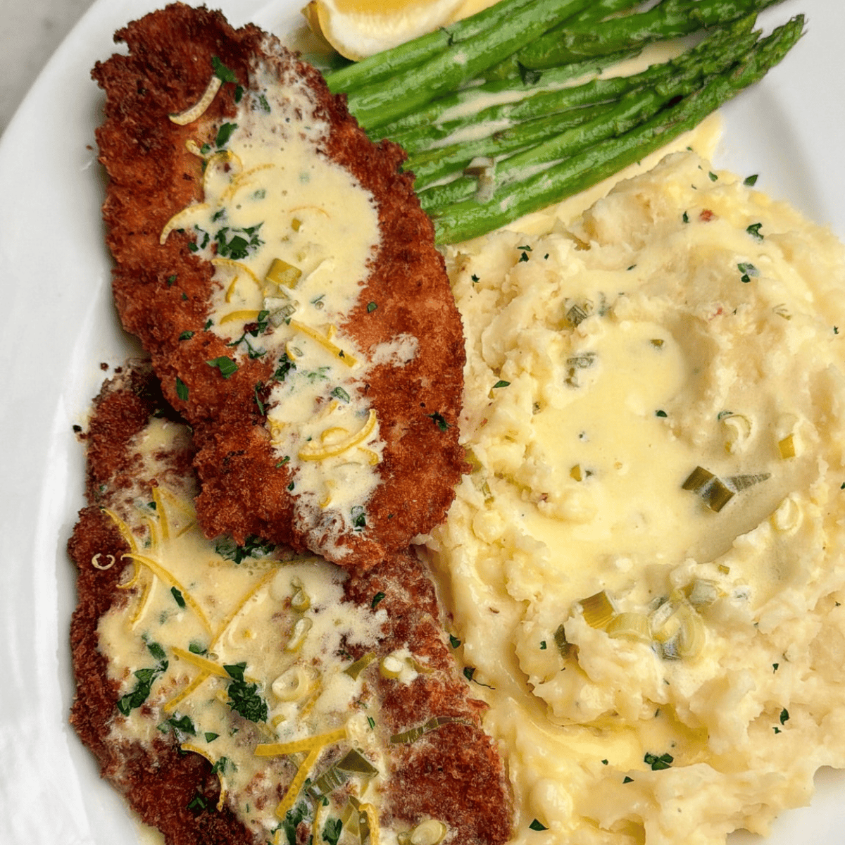 cheesecake factory copycat chicken costoletta with mashed potatoes and asparagus