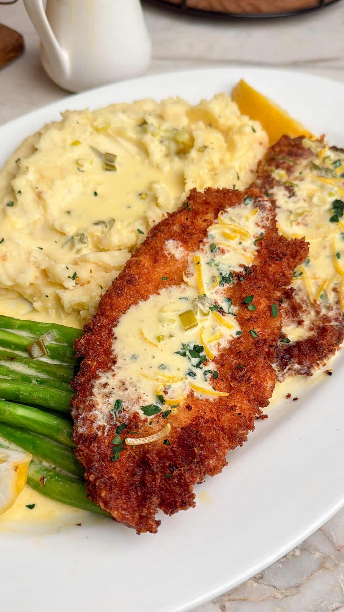 chicken costoletta smothered in lemon cream sauce