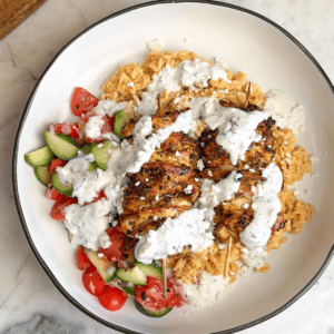 Overhead image of a Greek chicken bowl.