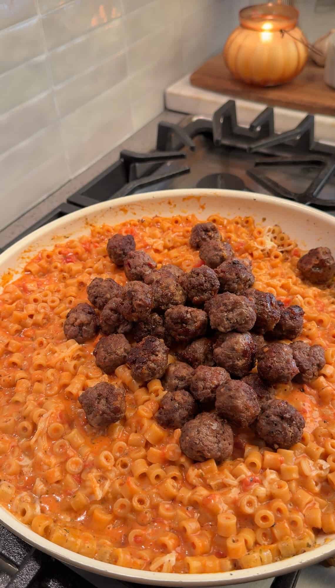 returning meatballs to pan for meatball pasta