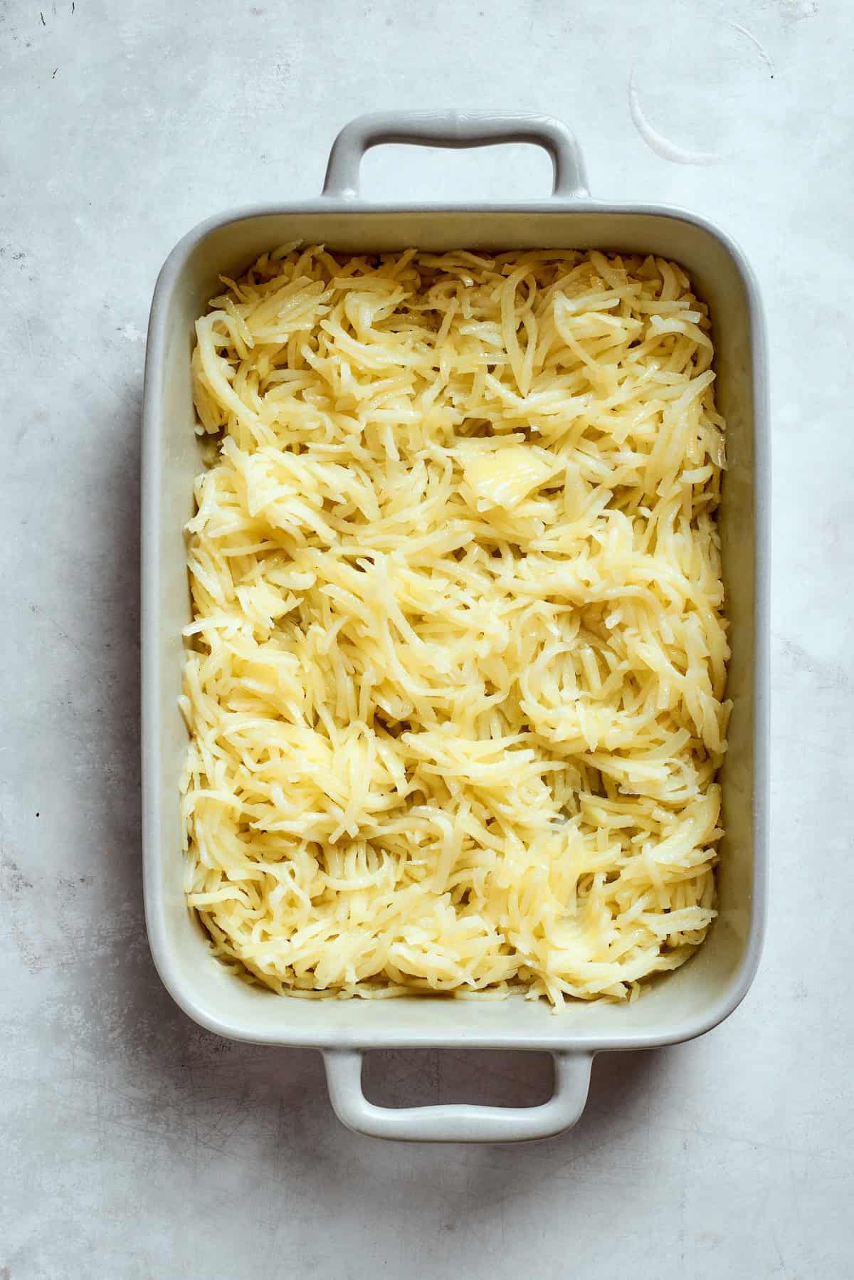 Loaded with bacon, eggs, and cheese and baked in one dish, this hashbrown breakfast casserole is the easiest way to do brunch for a crowd. Pre-baked hashbrowns spread in a chasserole dish.