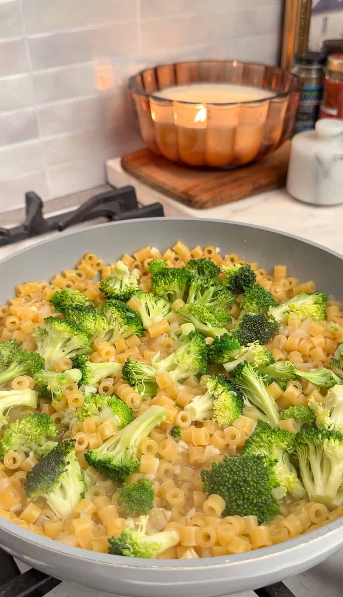 steaming broccoli in broccoli cheddar pasta