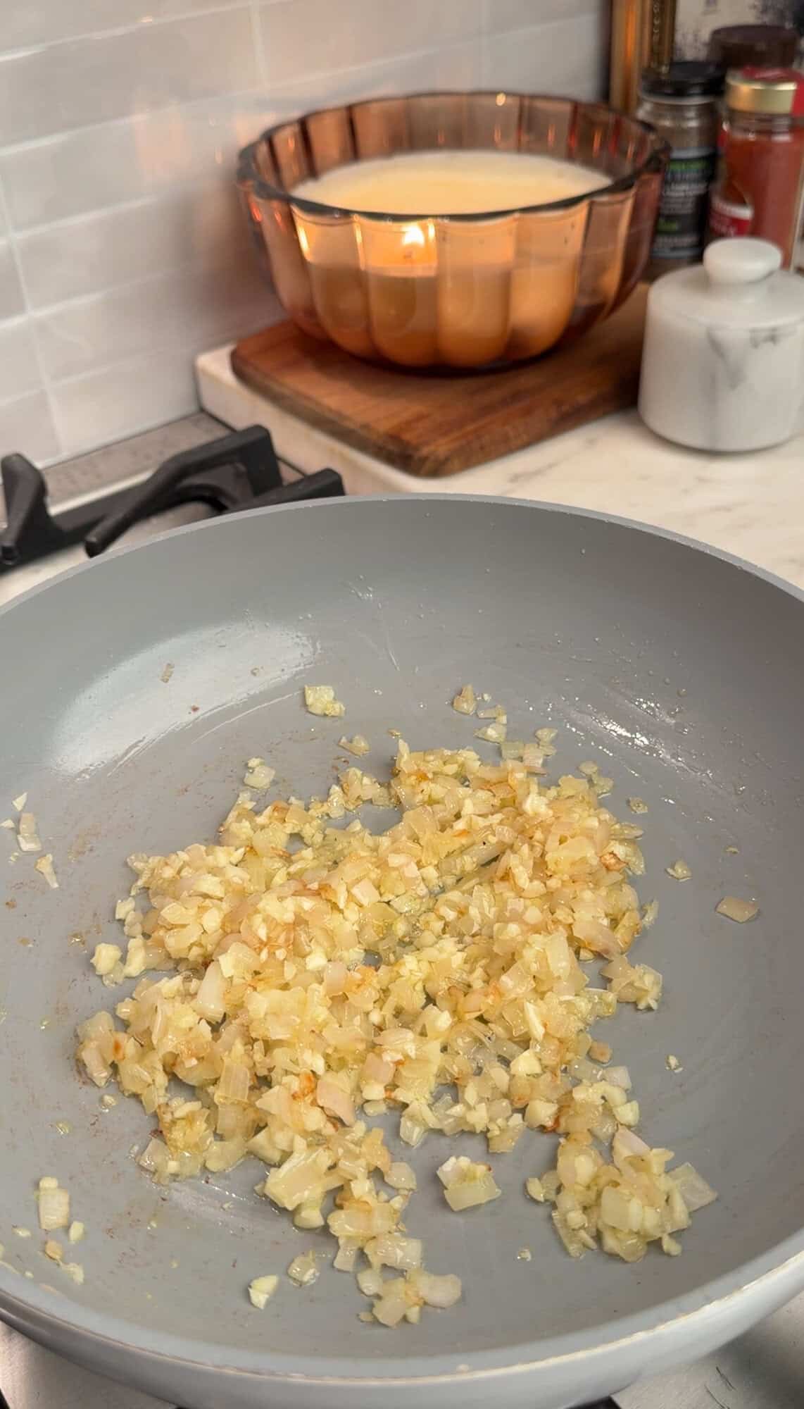 sautéing shallots and garlic in a pan