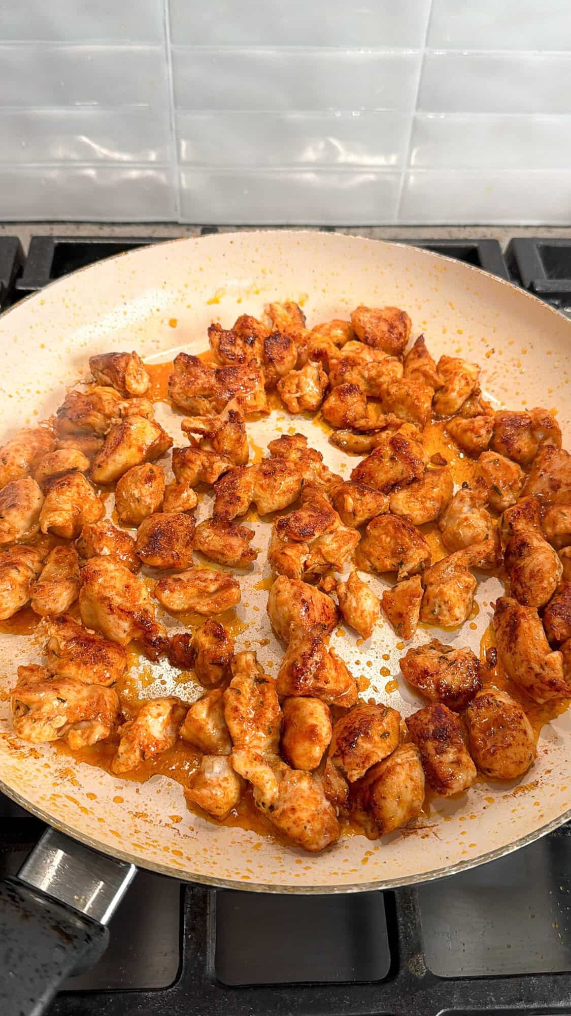 cooked chicken in a skillet for chicken and rice bake