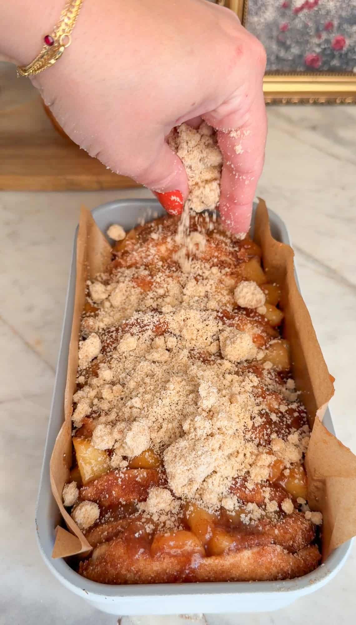 adding on the crumb topping