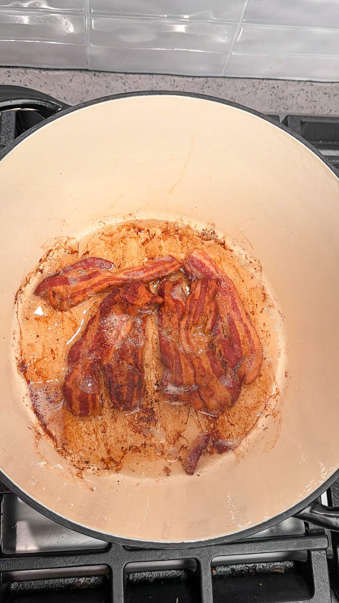 cooked bacon in a dutch oven