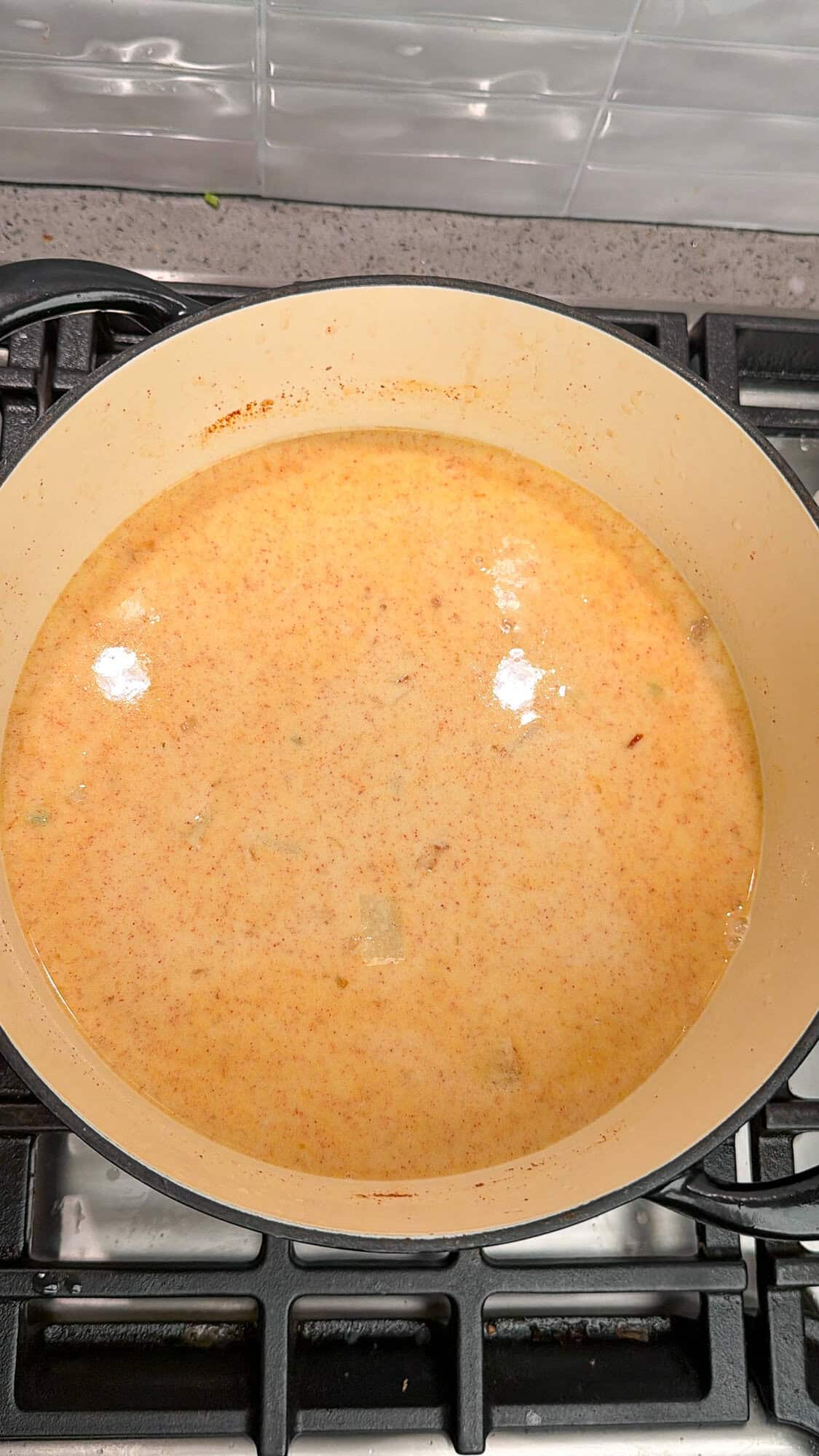 making the milk and broth base for loaded potato soup