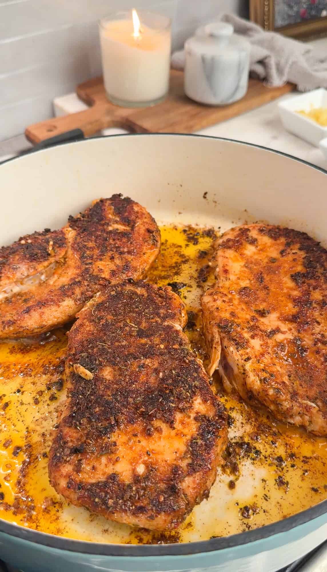 cajun chicken browning in a dutch oven