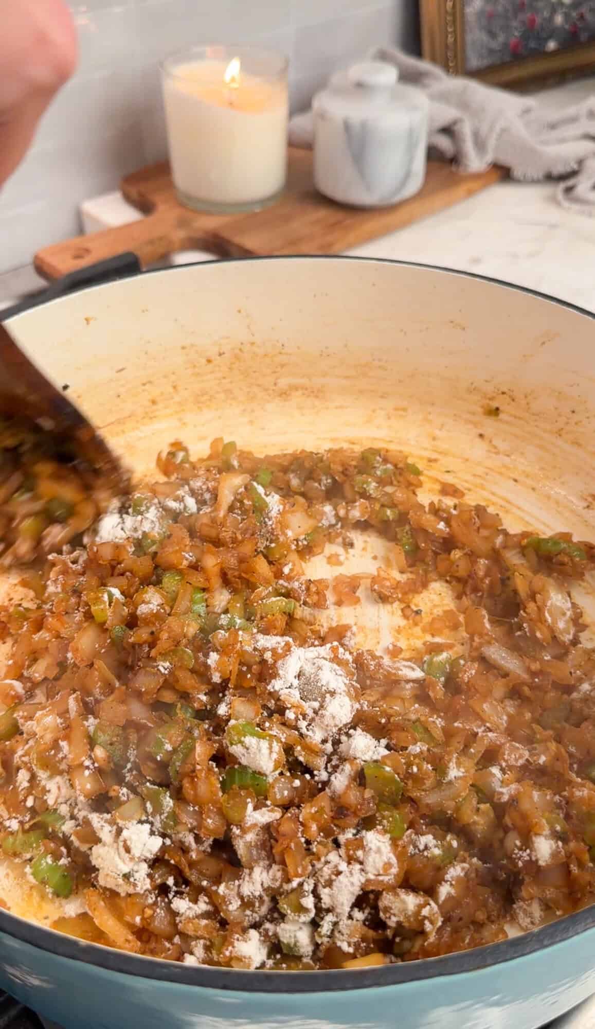 flour sprinkled over vegetables for chicken gnocchi soup
