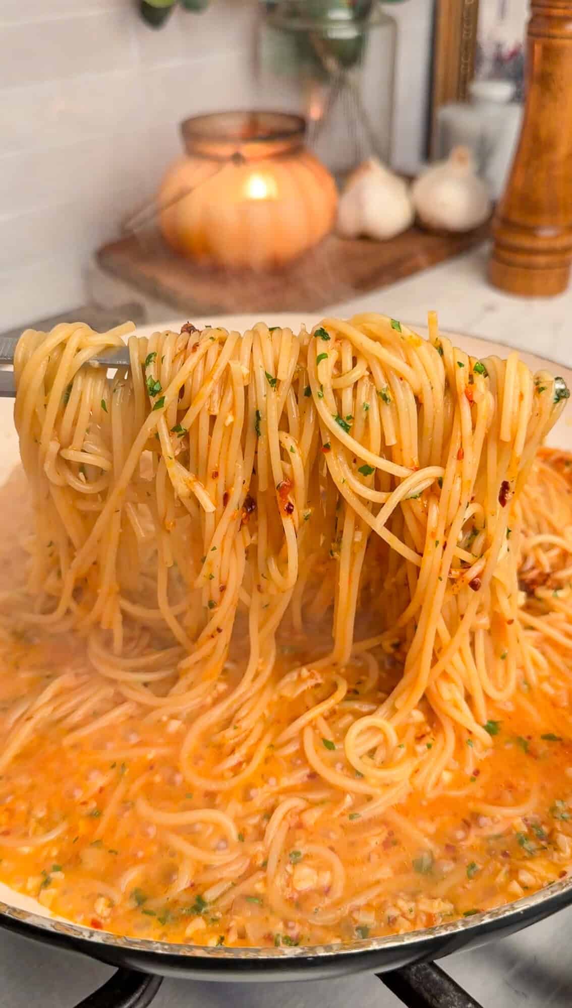 sizzling garlic butter noodles in a pan